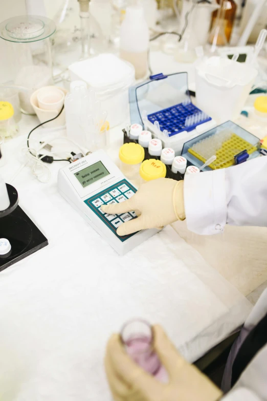 an scientist prepares an experiment for a substance