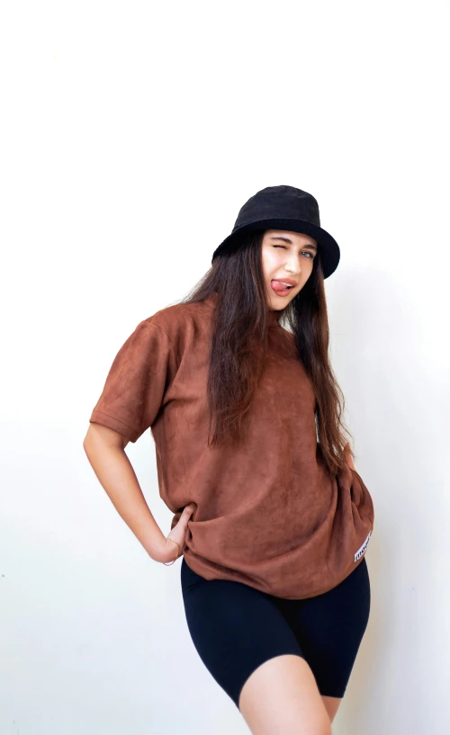 a beautiful young woman with long hair in a hat