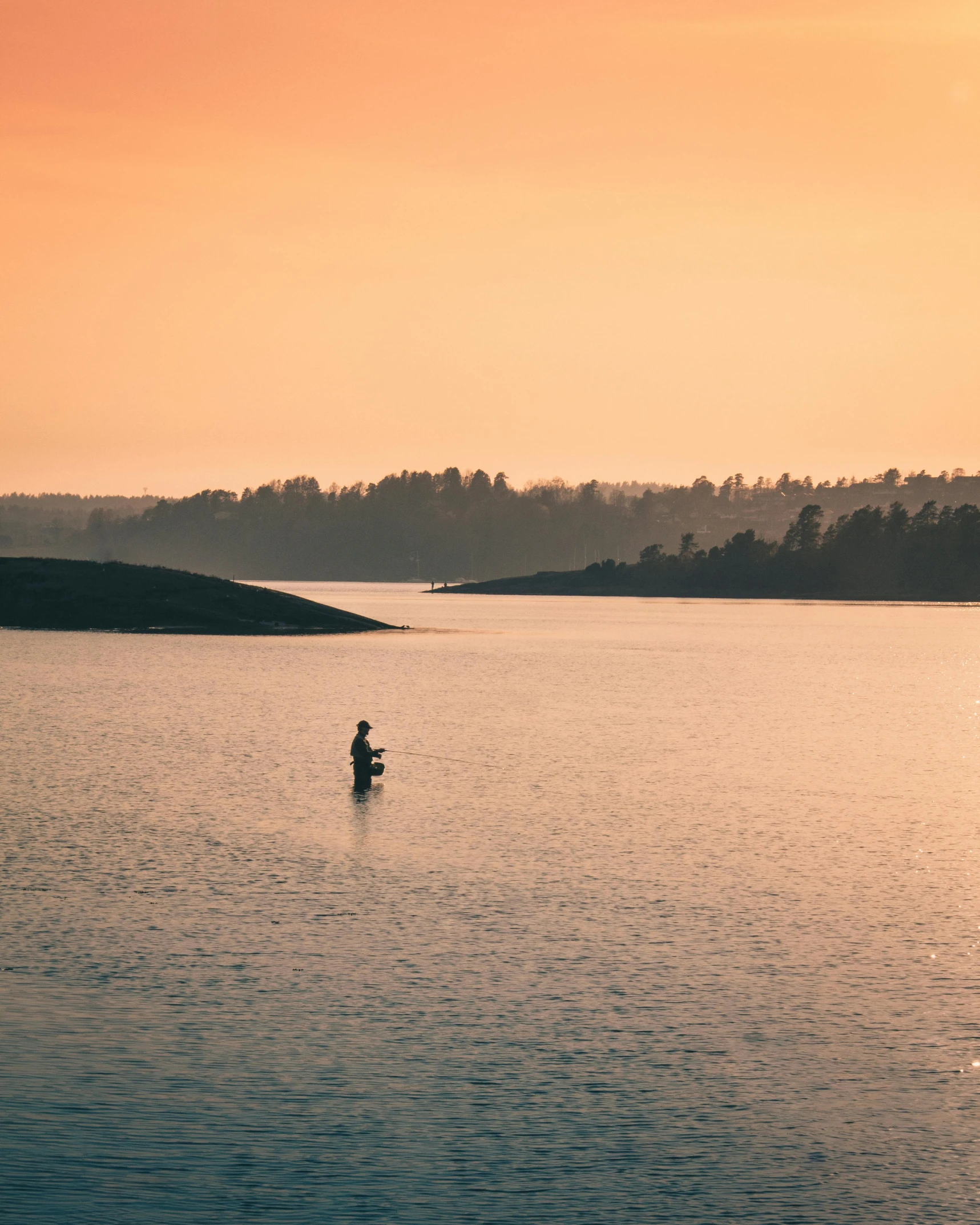 a person is out in the water paddling a boat