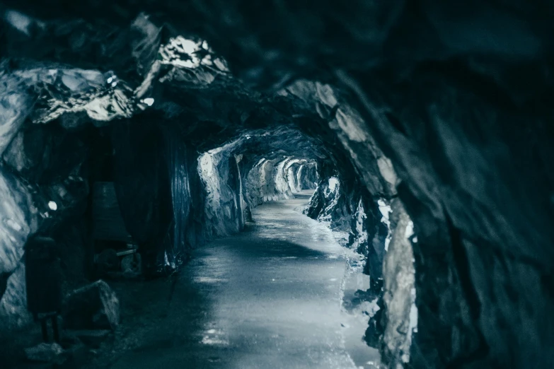 a long narrow tunnel in the middle of snow