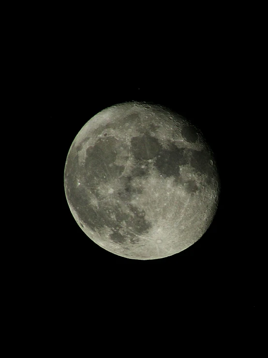 a very big full moon in the night sky