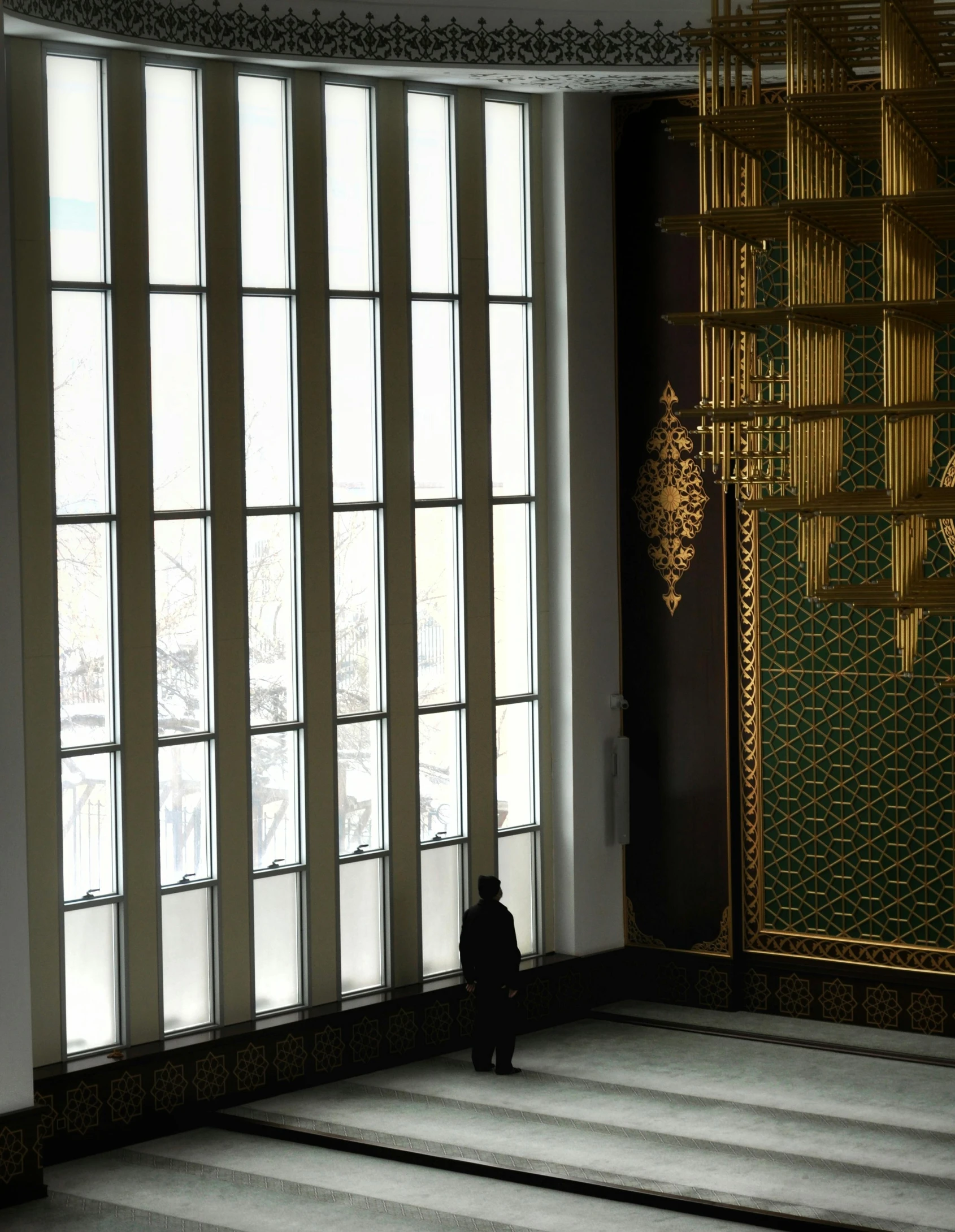 a large room filled with windows and curtains