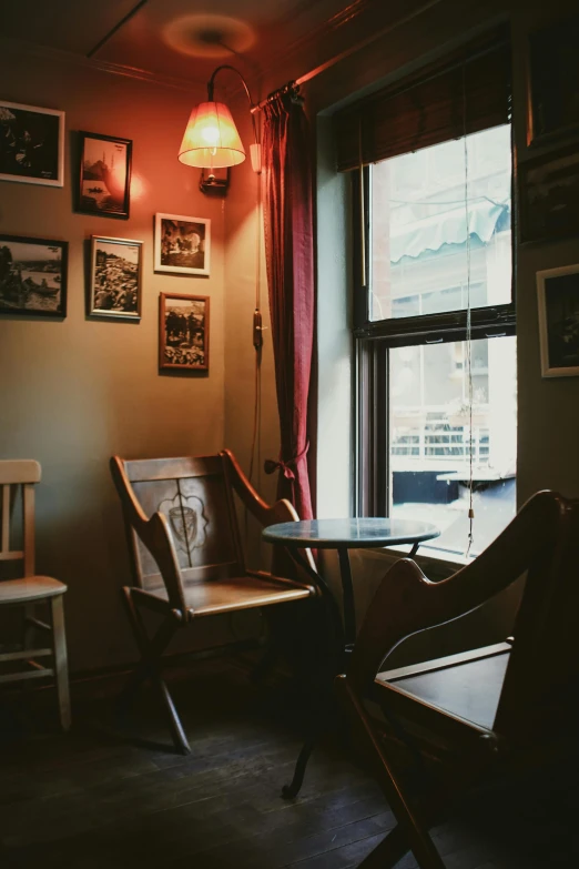 chairs sit near a window with the bright light coming through