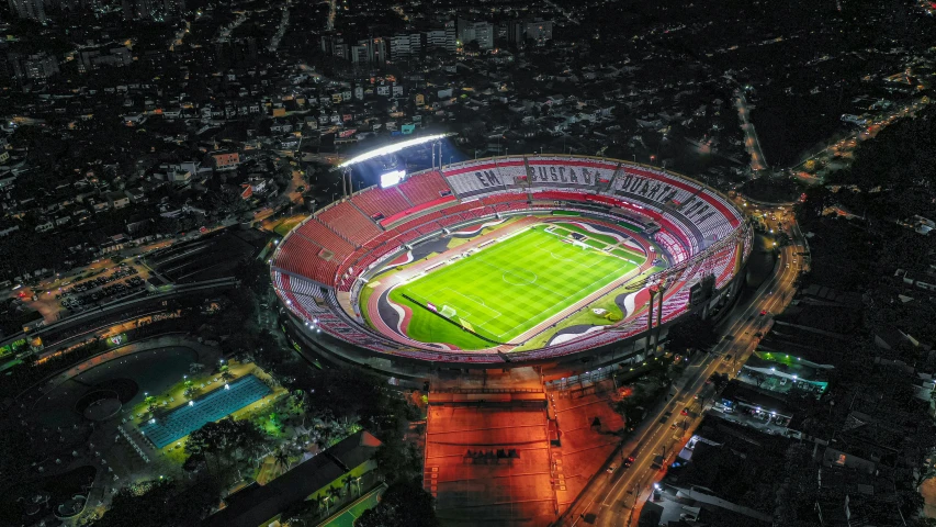 an aerial view of a soccer stadium at night