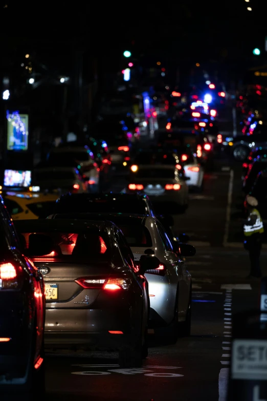 a bunch of cars sitting at night time