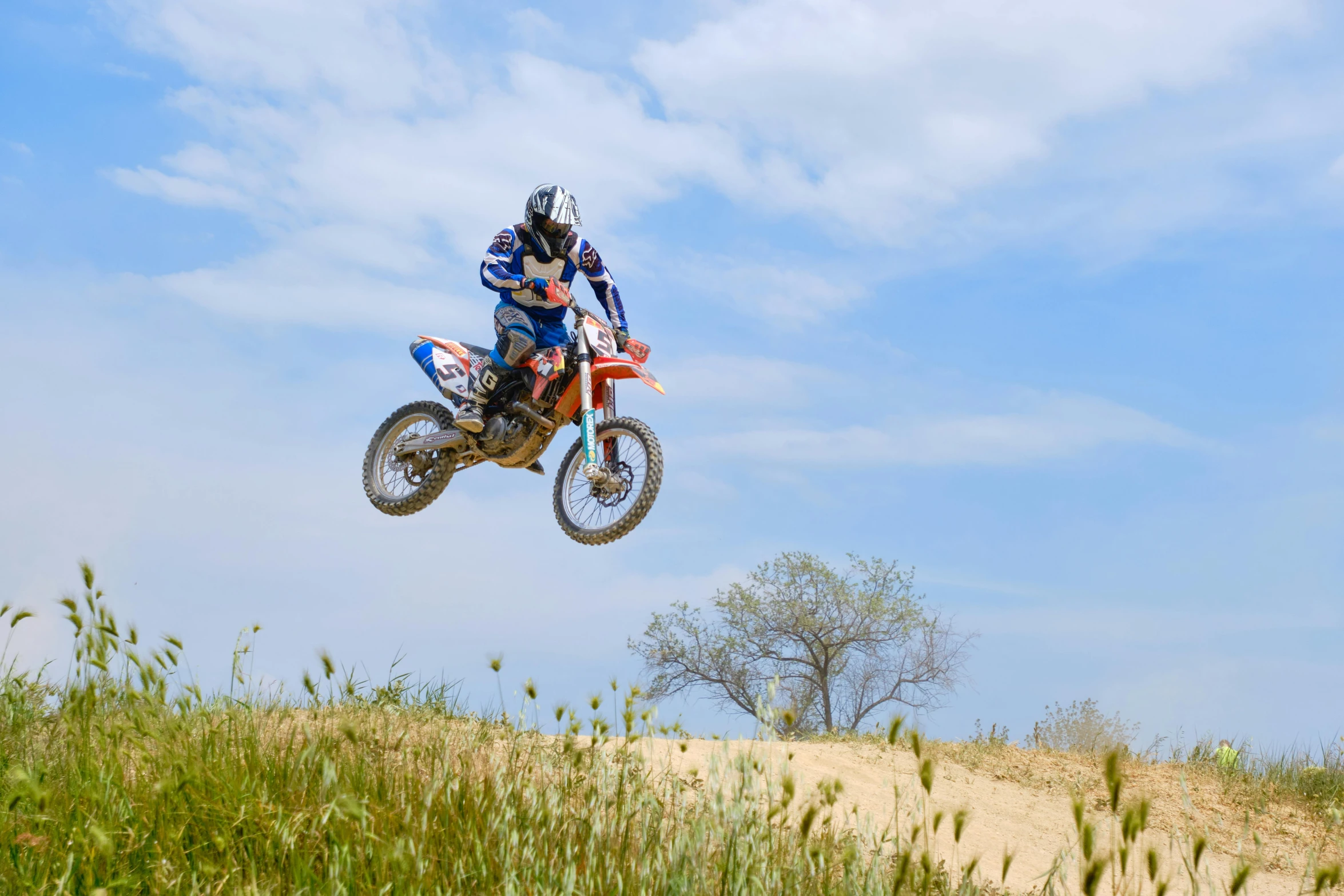 a person on a dirt bike doing tricks in the air