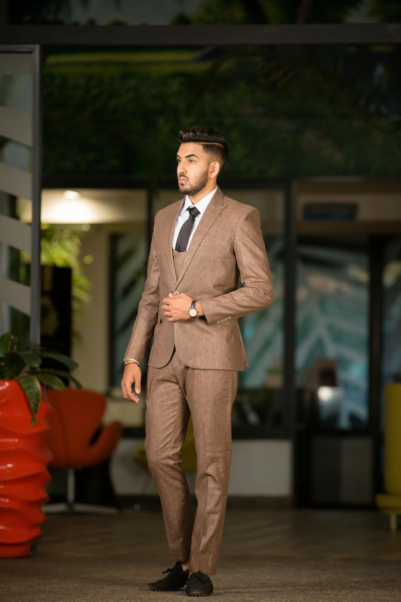 a man wearing a suit with an unoned shirt and tie