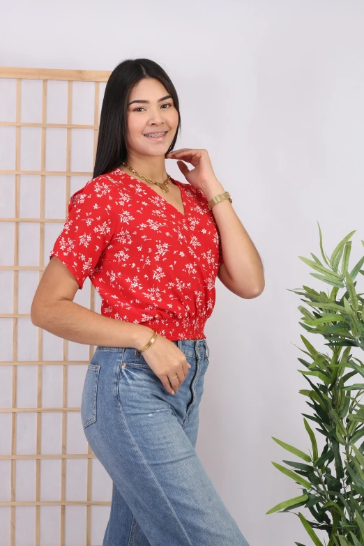 a beautiful woman in jeans posing for the camera