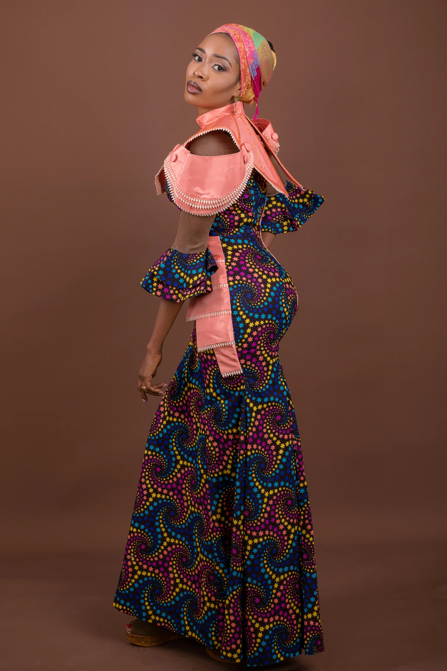 woman in a long colorful skirt and pink top