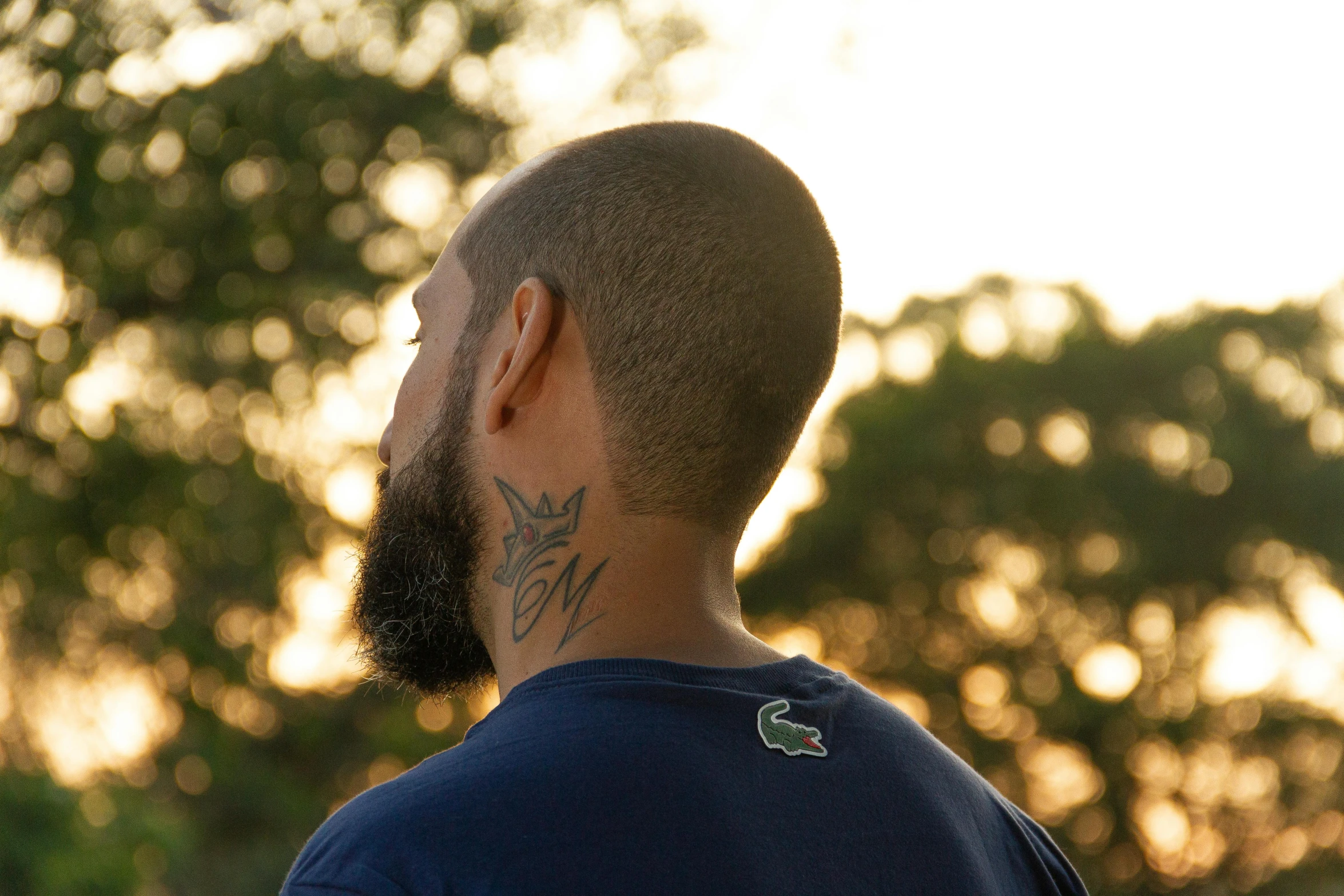 an image of a man with tattoos on his neck