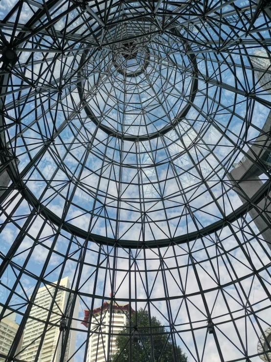 a glass structure with a skylight on top