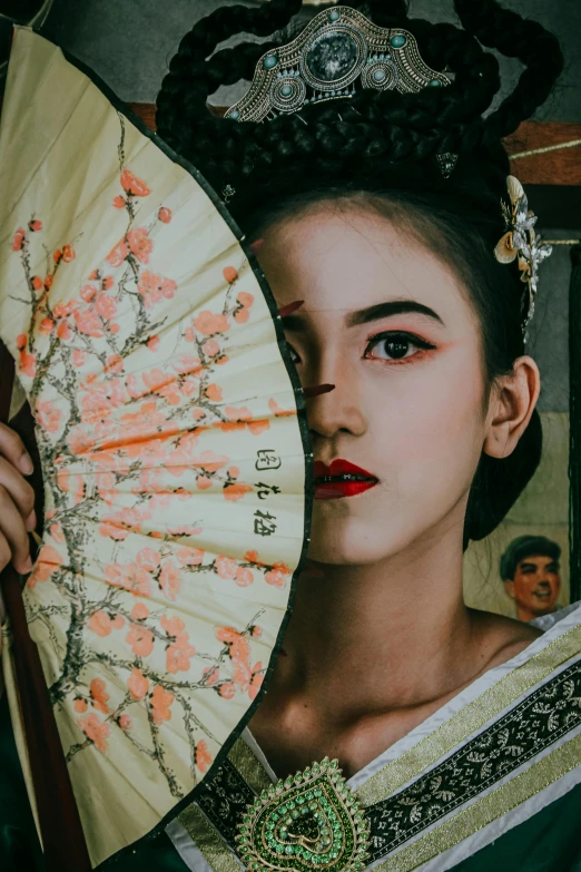 a woman in traditional dress holding up an umbrella