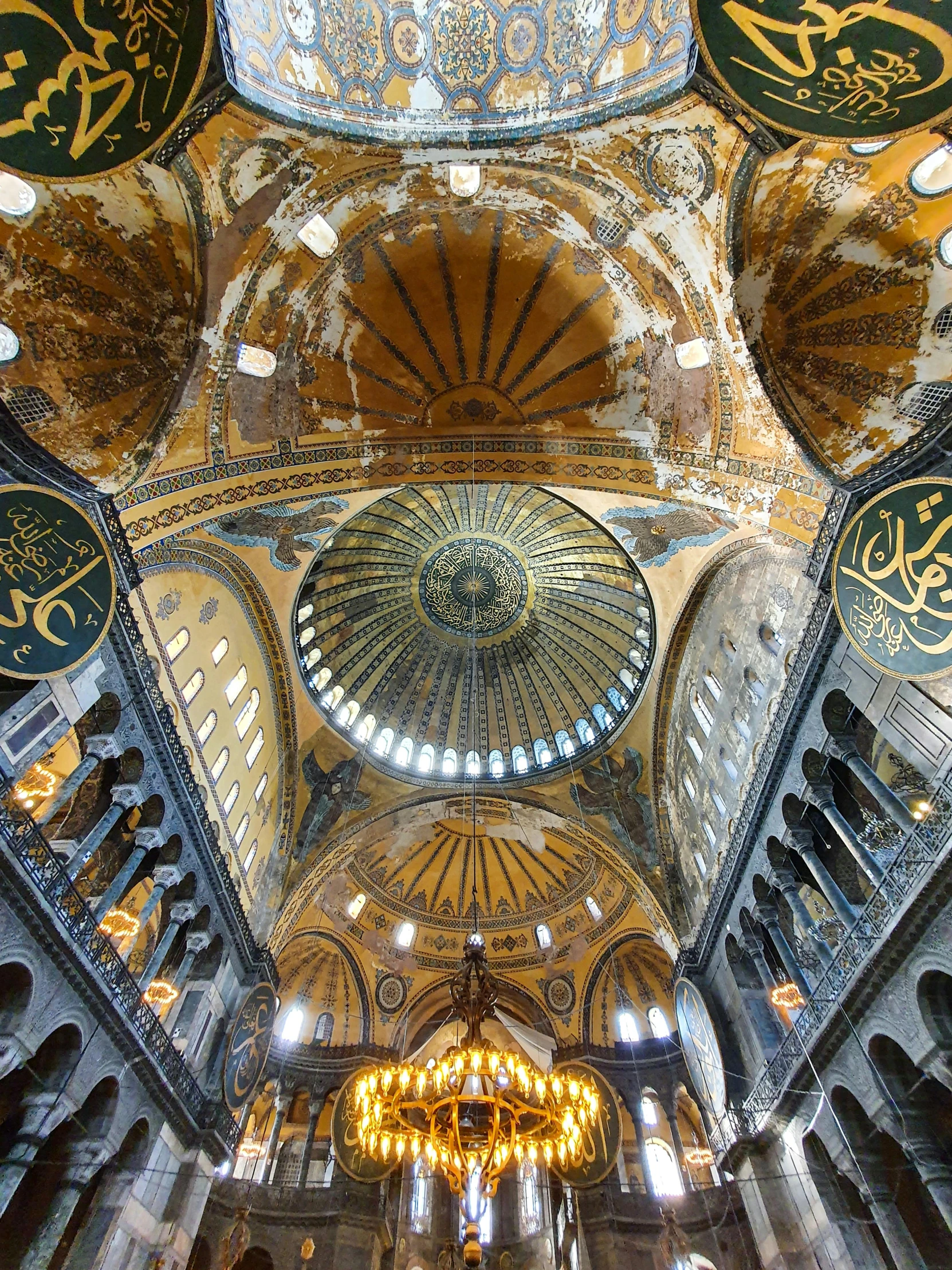 an ornately decorated ceiling with several chandeliers