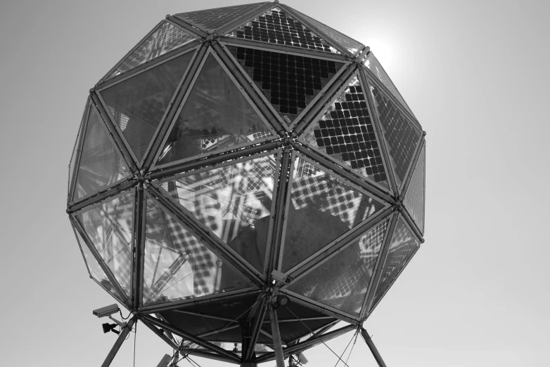 a large triangular structure sitting on top of a roof