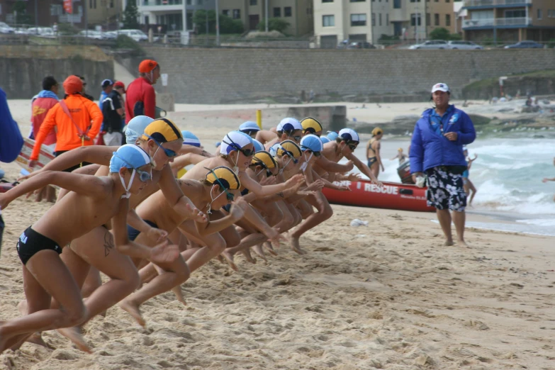 a group of swimmers and swimmers on the beach