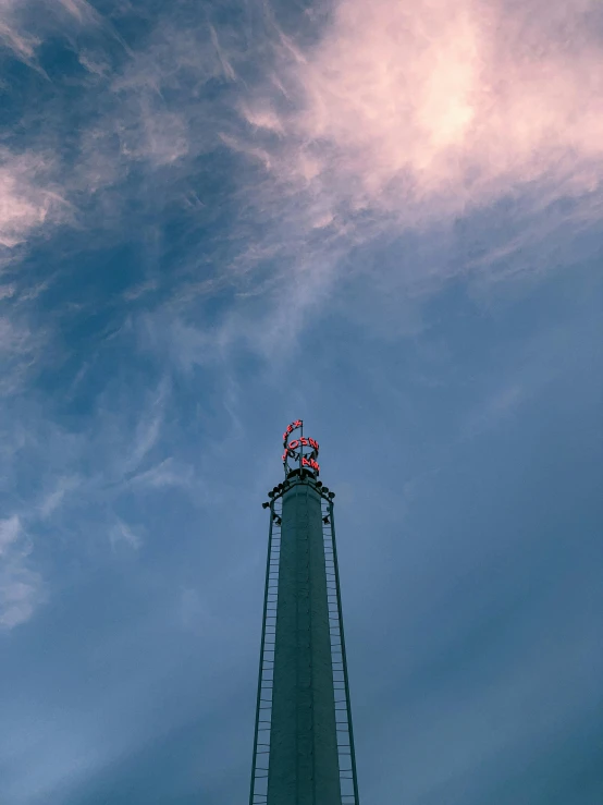 a very tall tower with a sky background