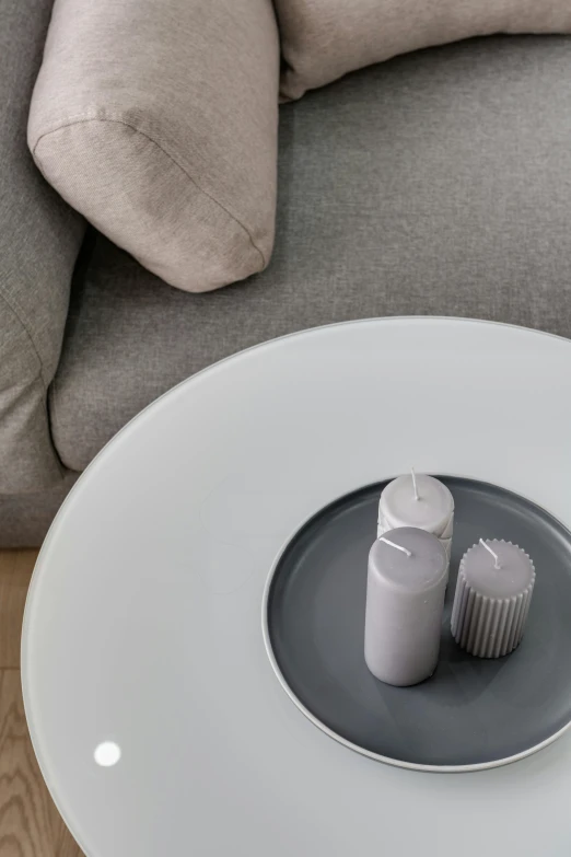 an pills bottle sits on top of a coffee table