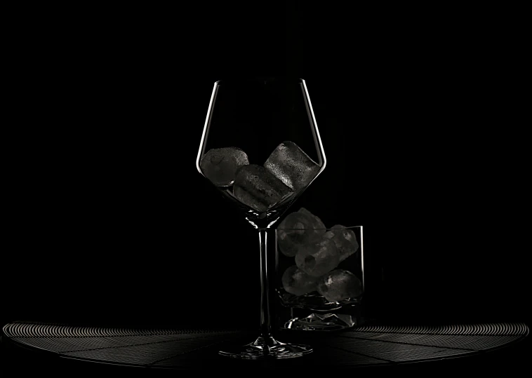 an ice cubes in a wine glass on a dark background