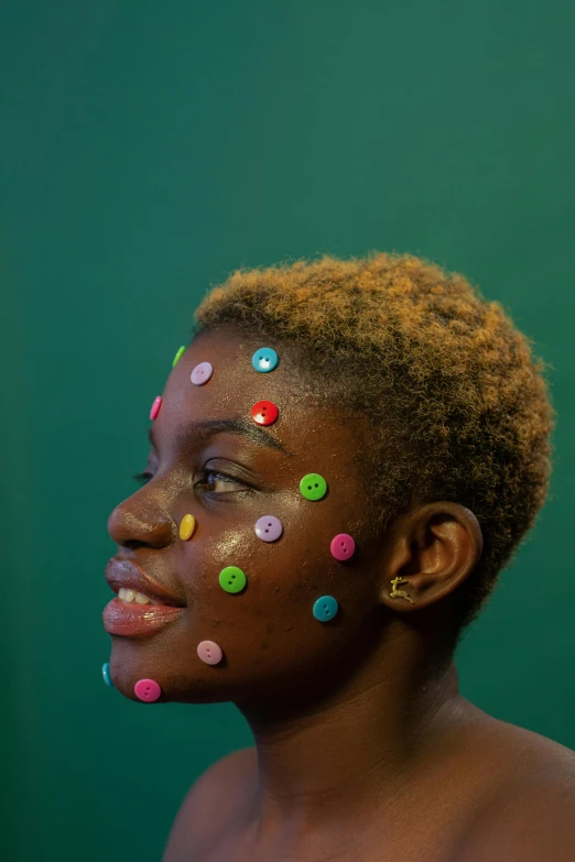 there is a young woman with sprinkles on her face