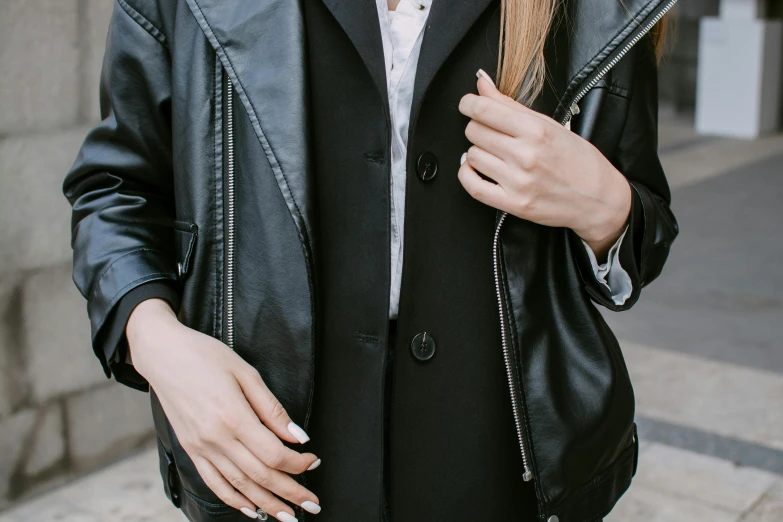 a person with glasses holding a hair brush