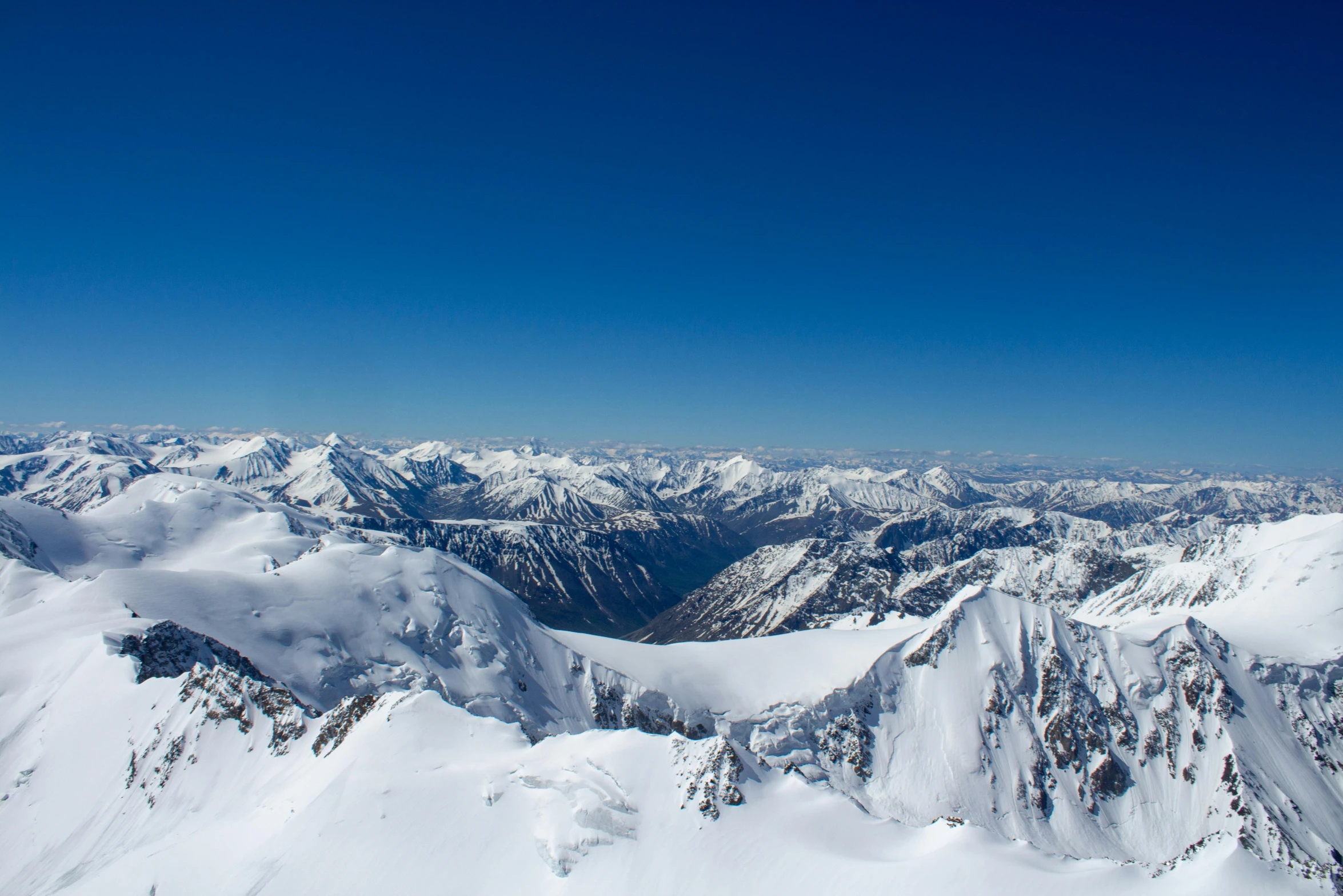 a large mountain with some snow on it