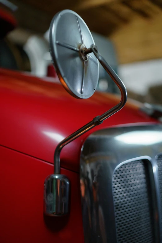 a red car with an antenna attached to it