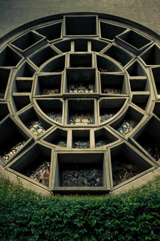 a picture of a circular building with lots of plants