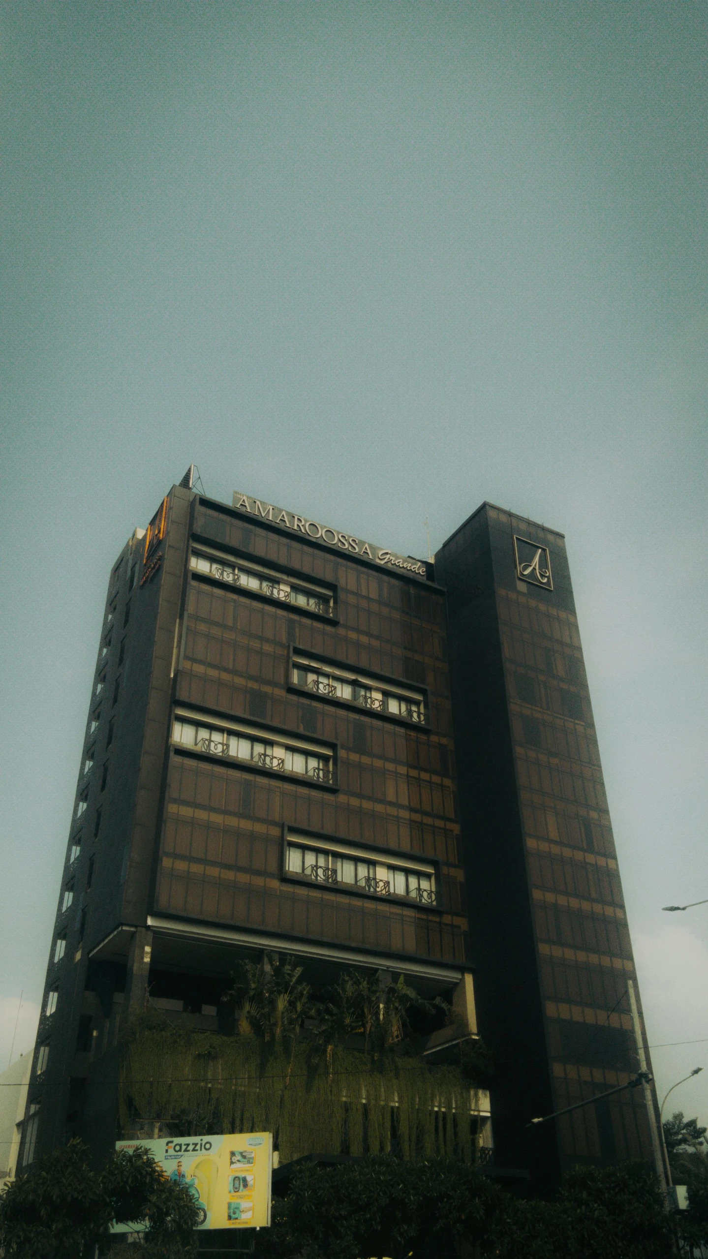 the top of a tall building with many windows