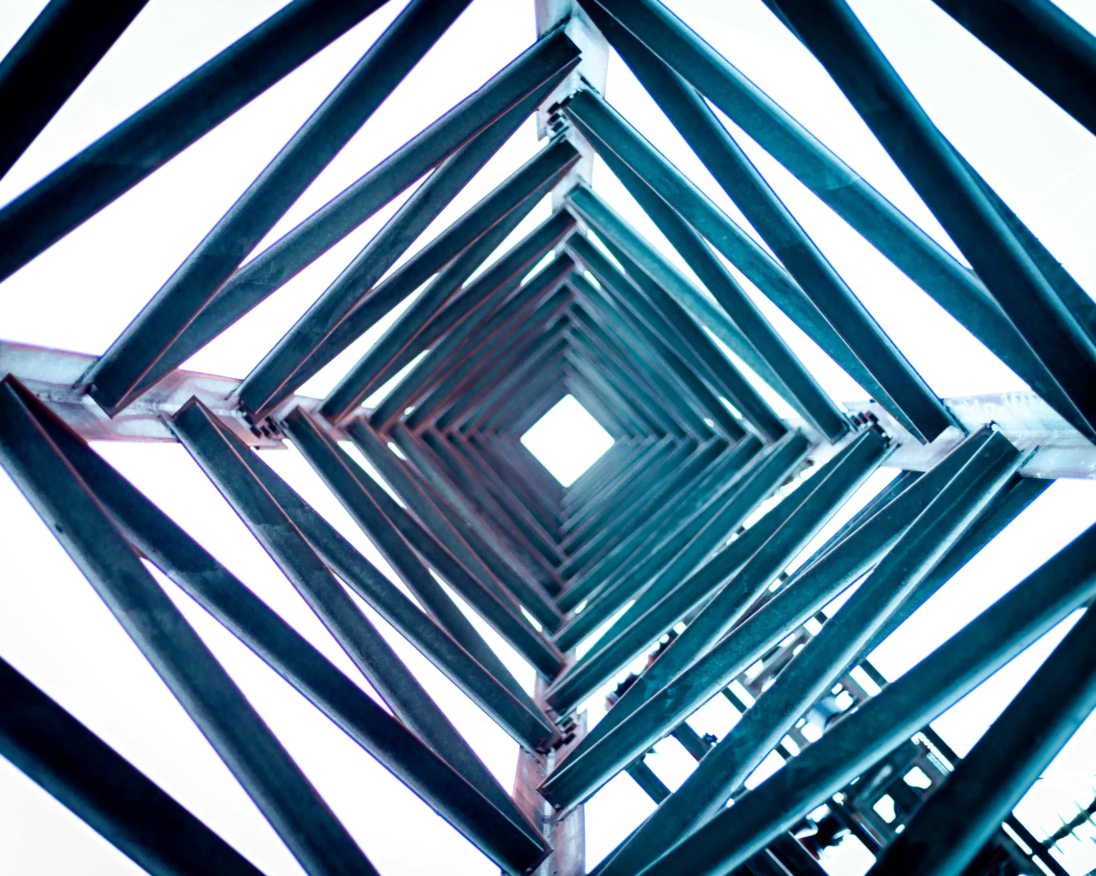the bottom of a metal structure with a square pattern