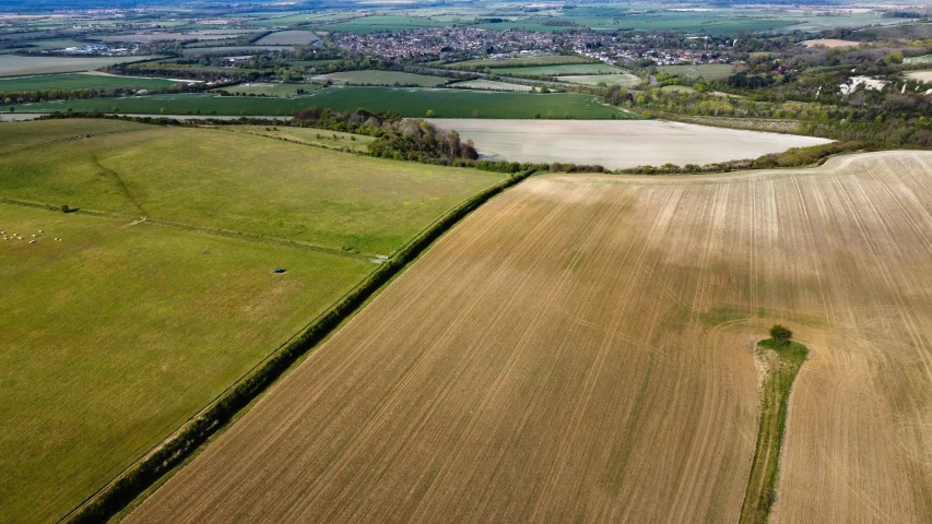 an aerial view of farmland and farm fields in rural australia