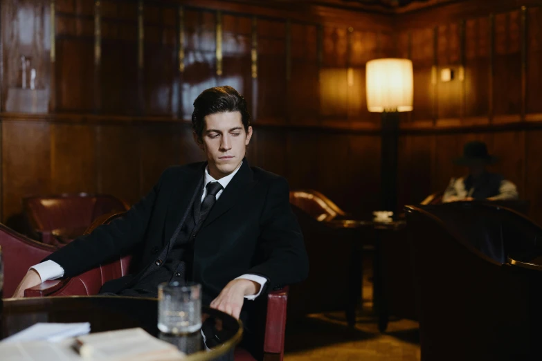 a man is sitting at a table alone in the restaurant