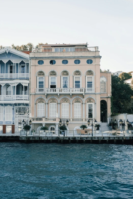 a view of several old building from across the water