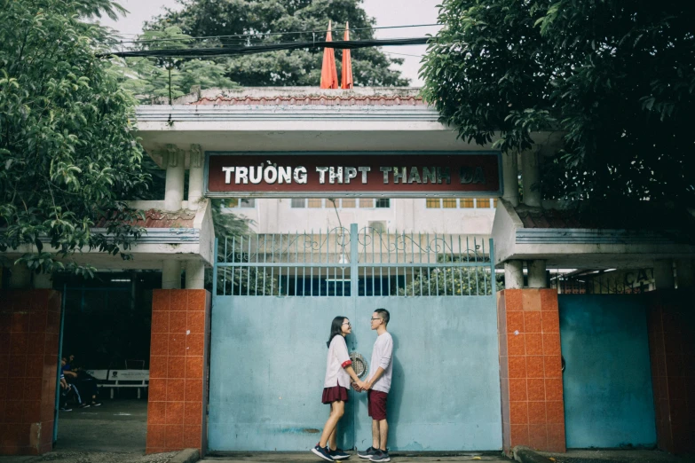 a couple of people that are standing in front of a building