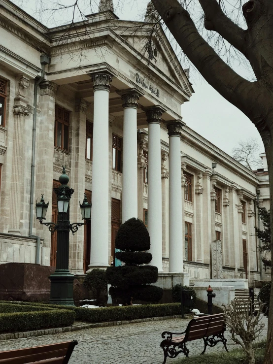 an old building with pillars and large columns