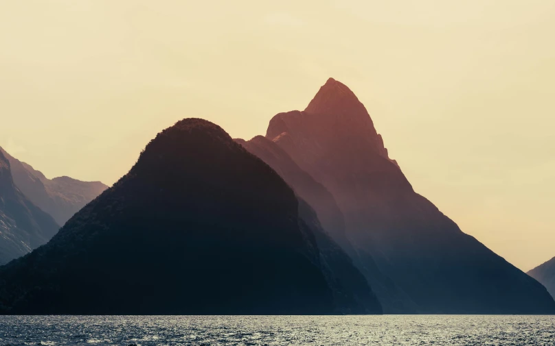 mountains and the ocean during a sunset