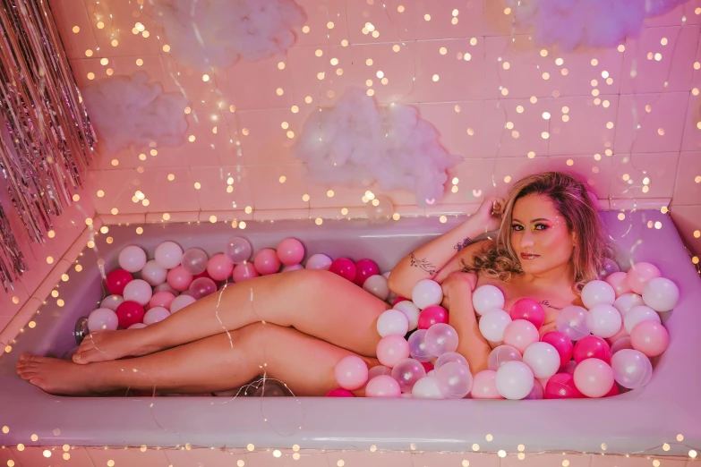 a woman is relaxing in the bubble bath