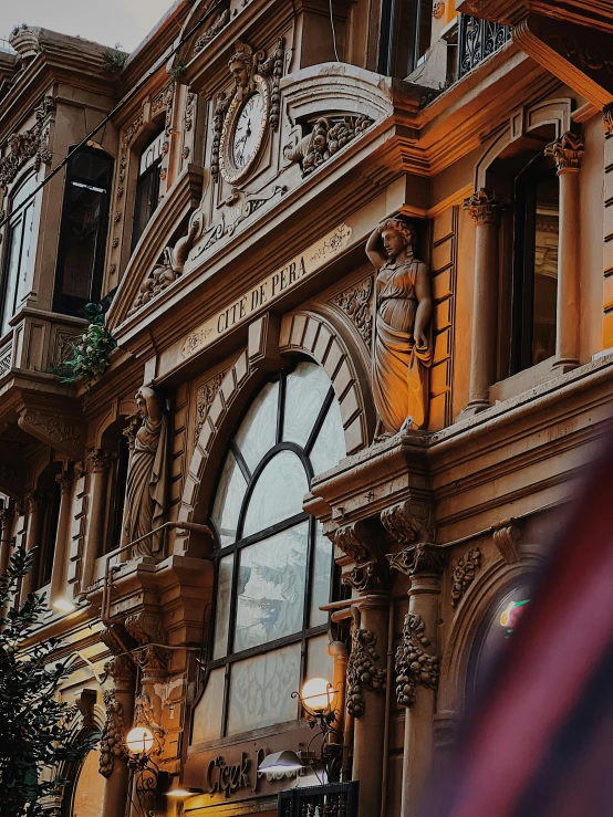 a close up s of a fancy looking building with clock towers and arched windows