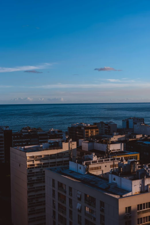 some buildings a body of water and a sky