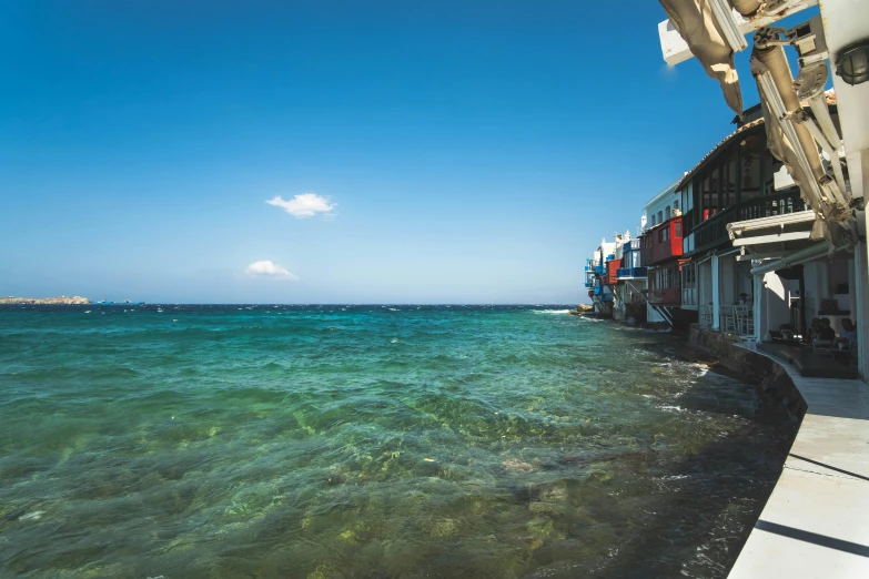 a body of water with buildings near by