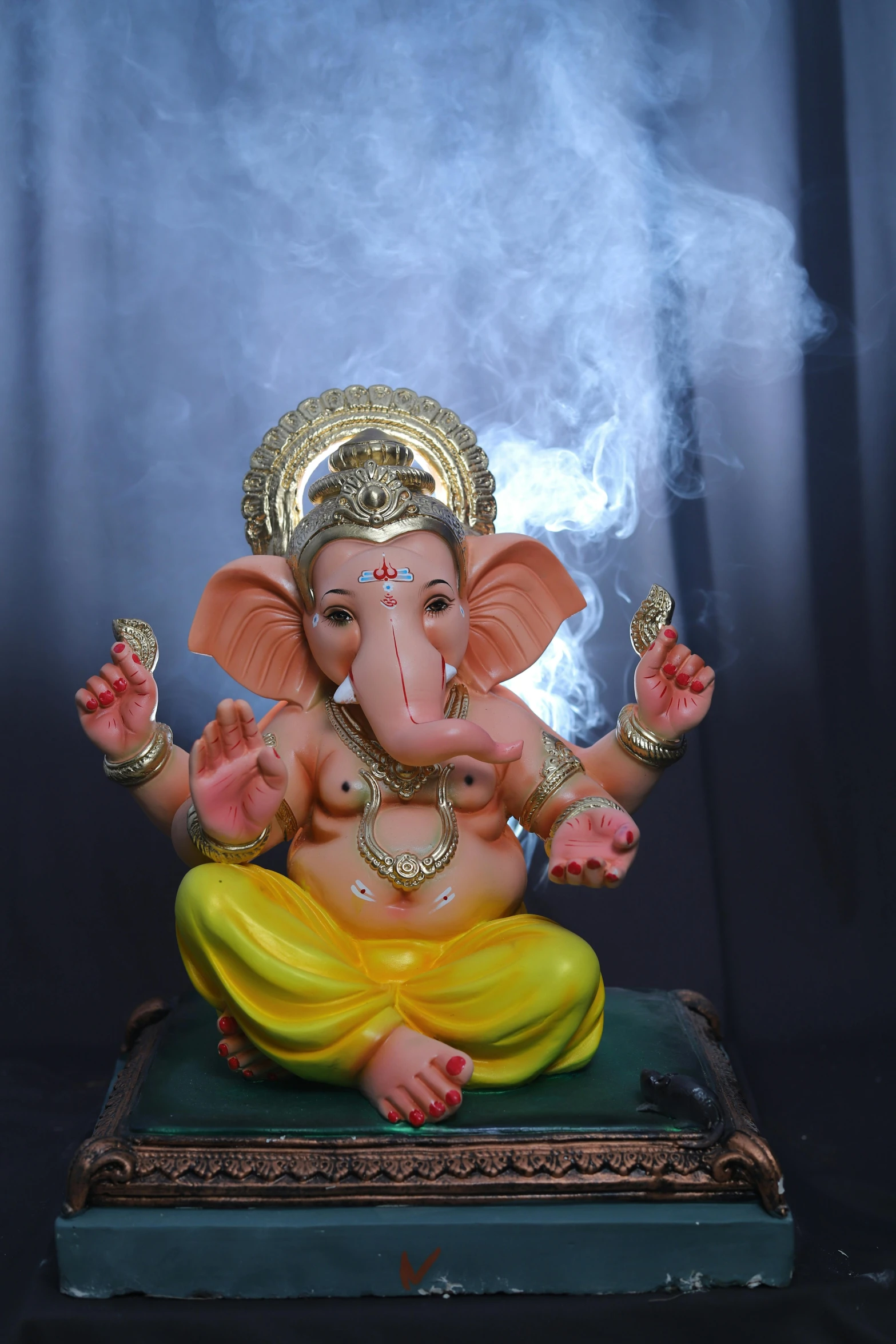 an elephant statue on top of a blue table