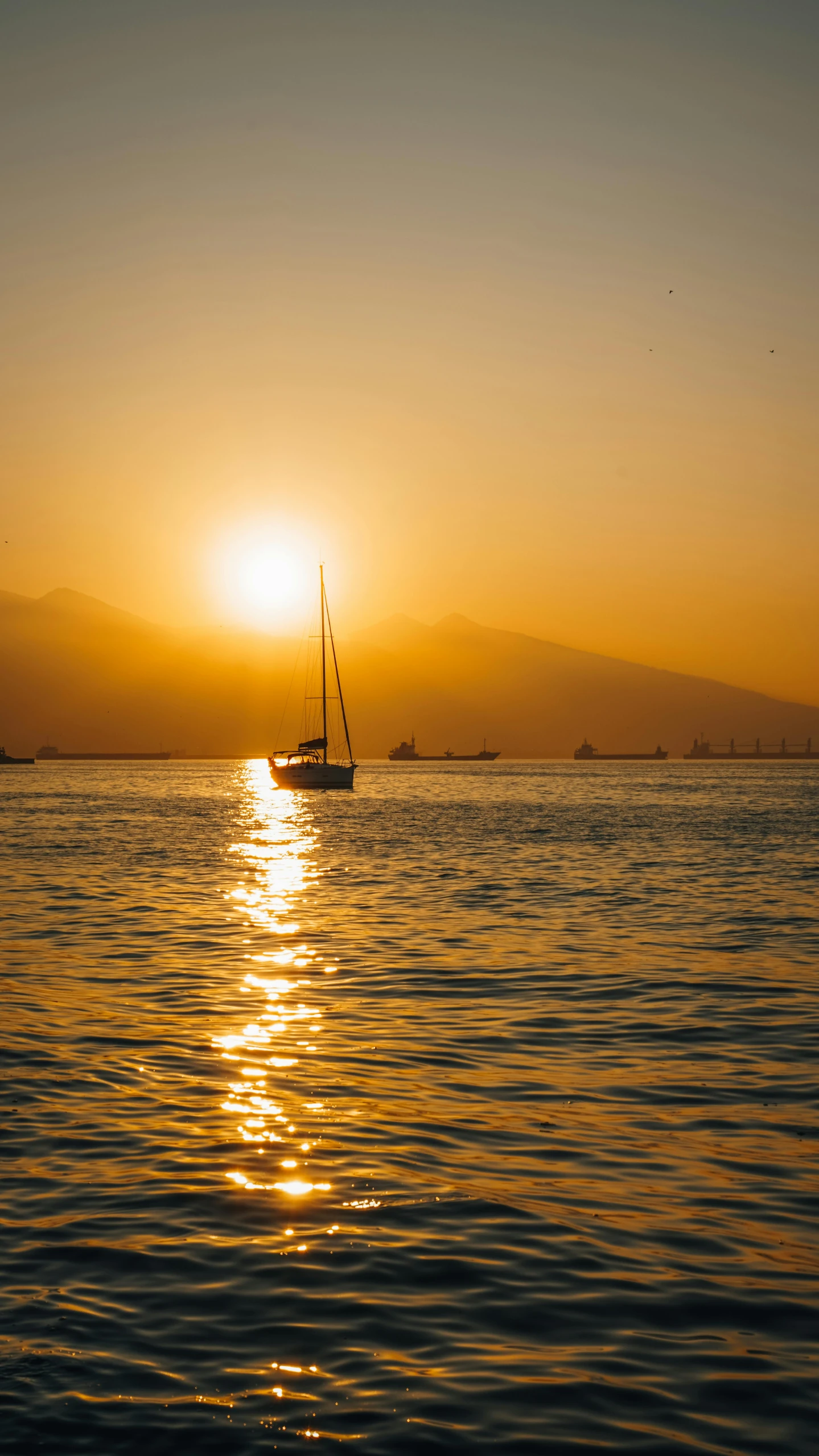 a ship on the water at sunset