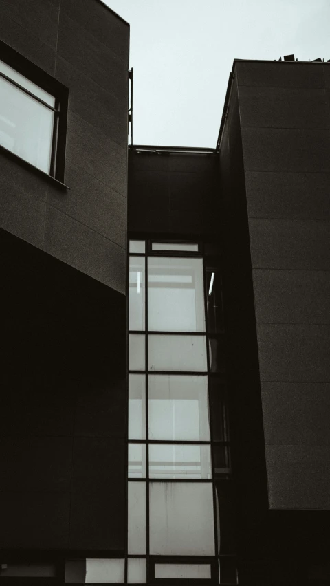 a couple of windows in front of a building