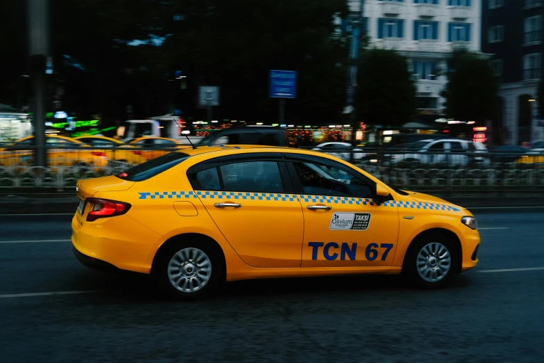 a taxi cab is seen with yellow caution tape around its tires