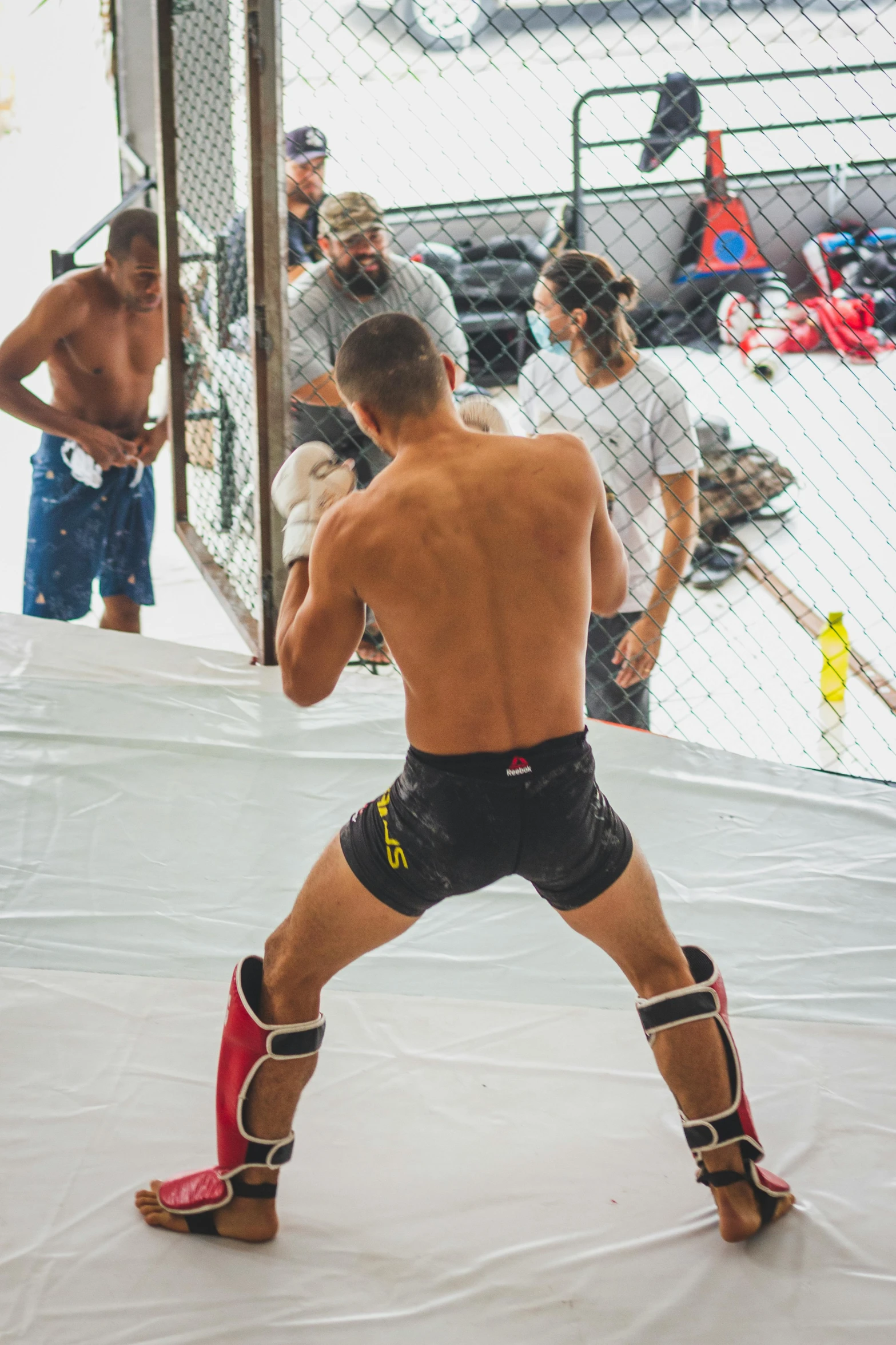 the wrestler is hitting his opponent with his right hand