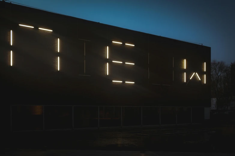 a building with the word effi on it's side lit up