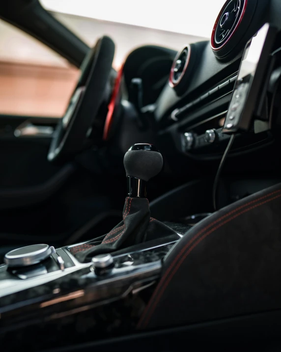 the interior of a vehicle with a steering wheel and a car horn horn