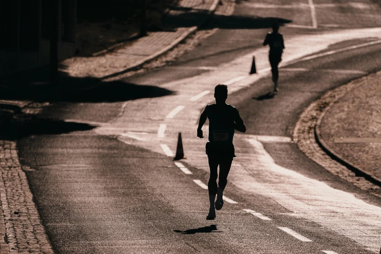 three people running in the dark in silhouette