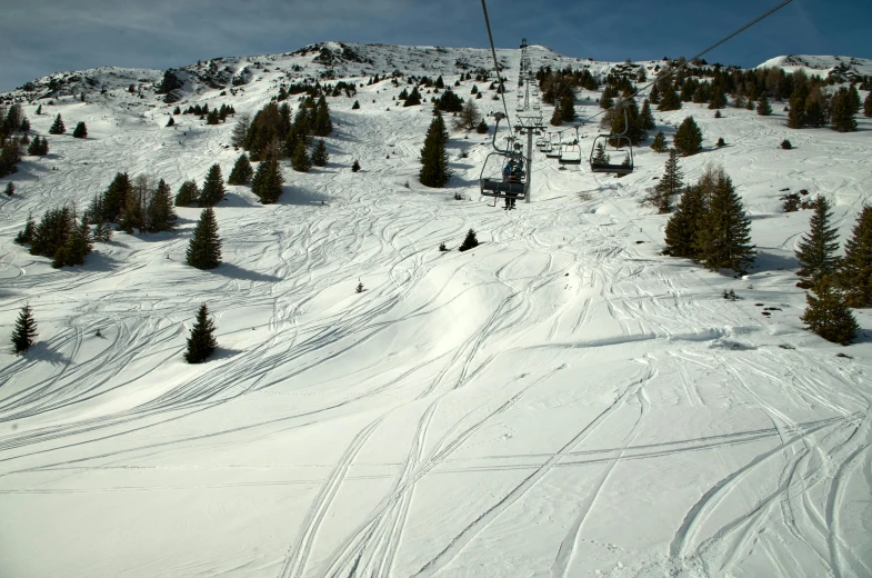 the ski lift is being operated on a hill