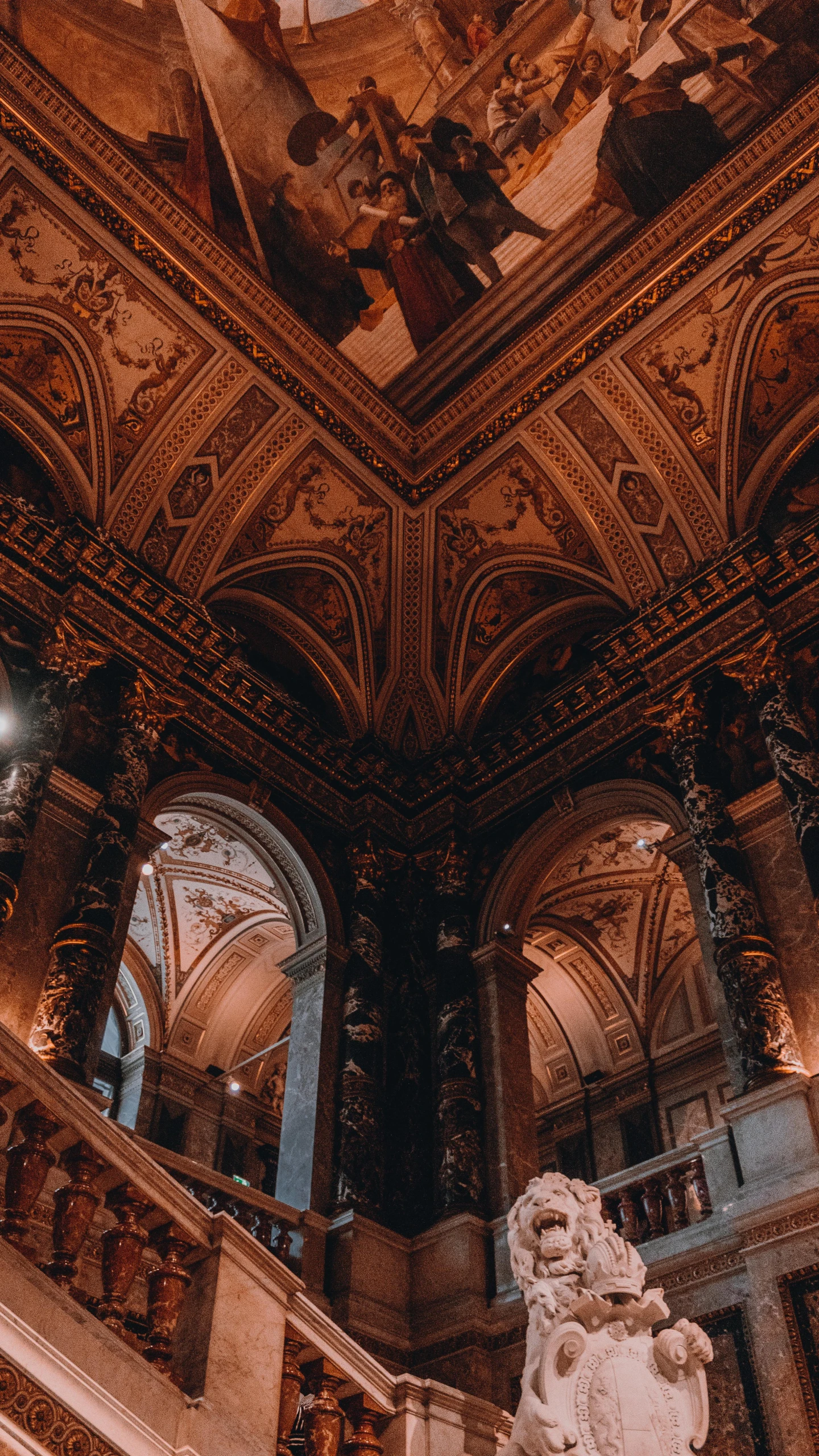 a beautiful and ornate room with a statue inside