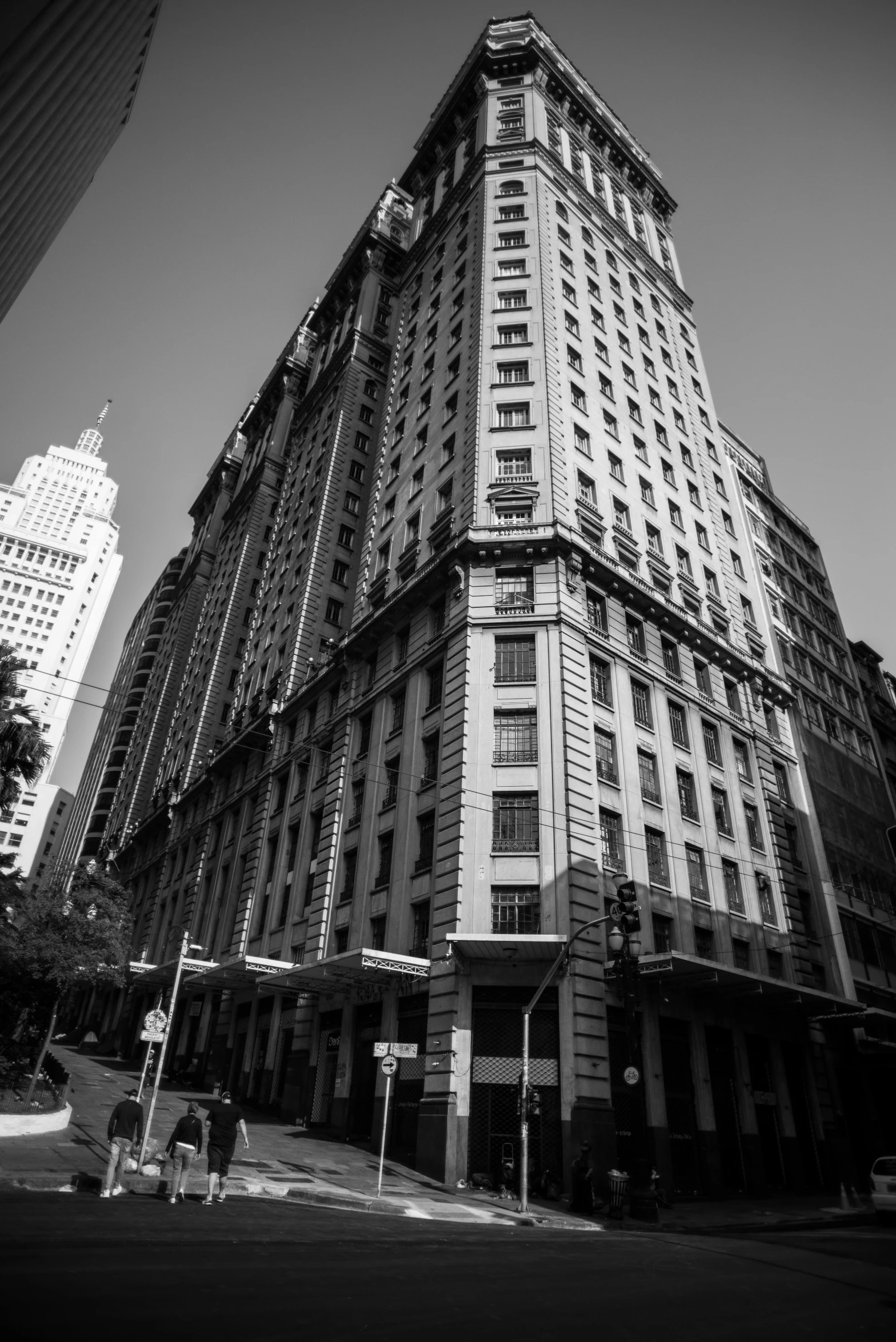 a large tall building next to a traffic light